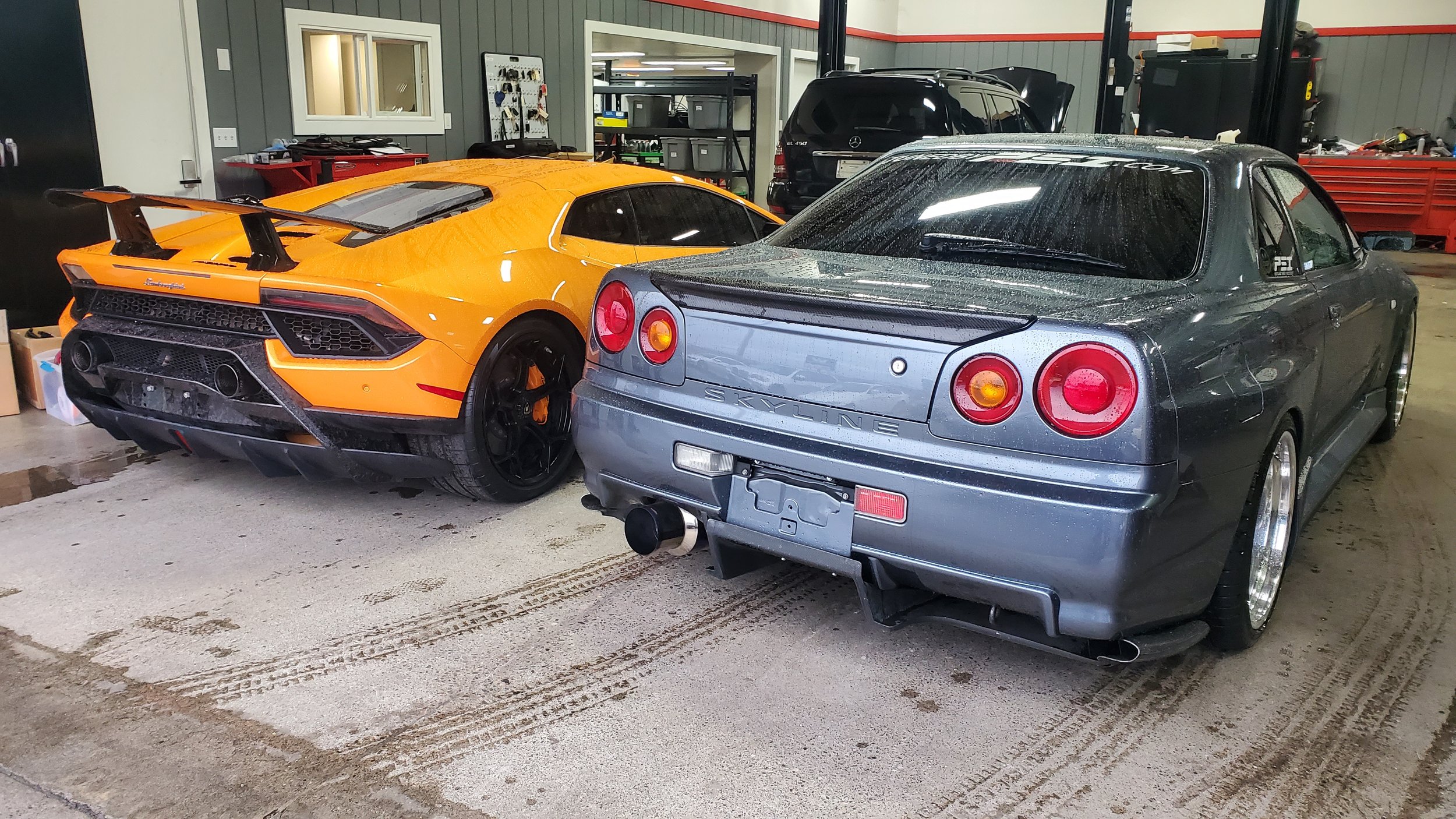 Lamborghini and Nissan in the shop